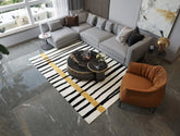 Luxury artisan rug with bold black stripes and vertical mustard line.